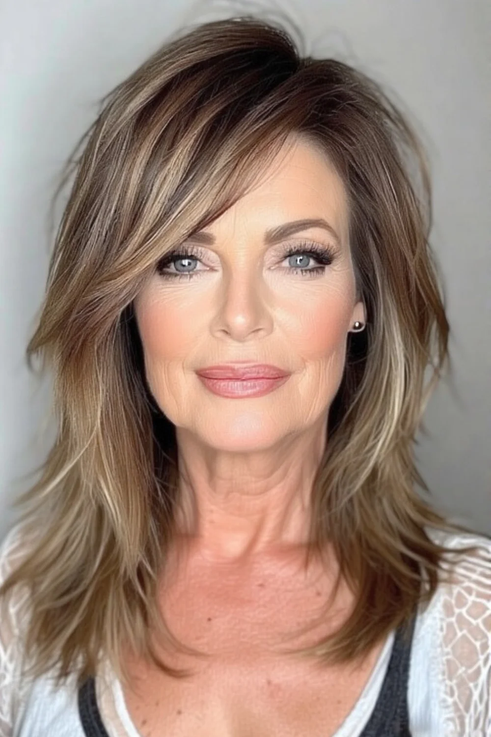 Haircut with flipped ends and asymmetrical bangs for a playful, edgy style.