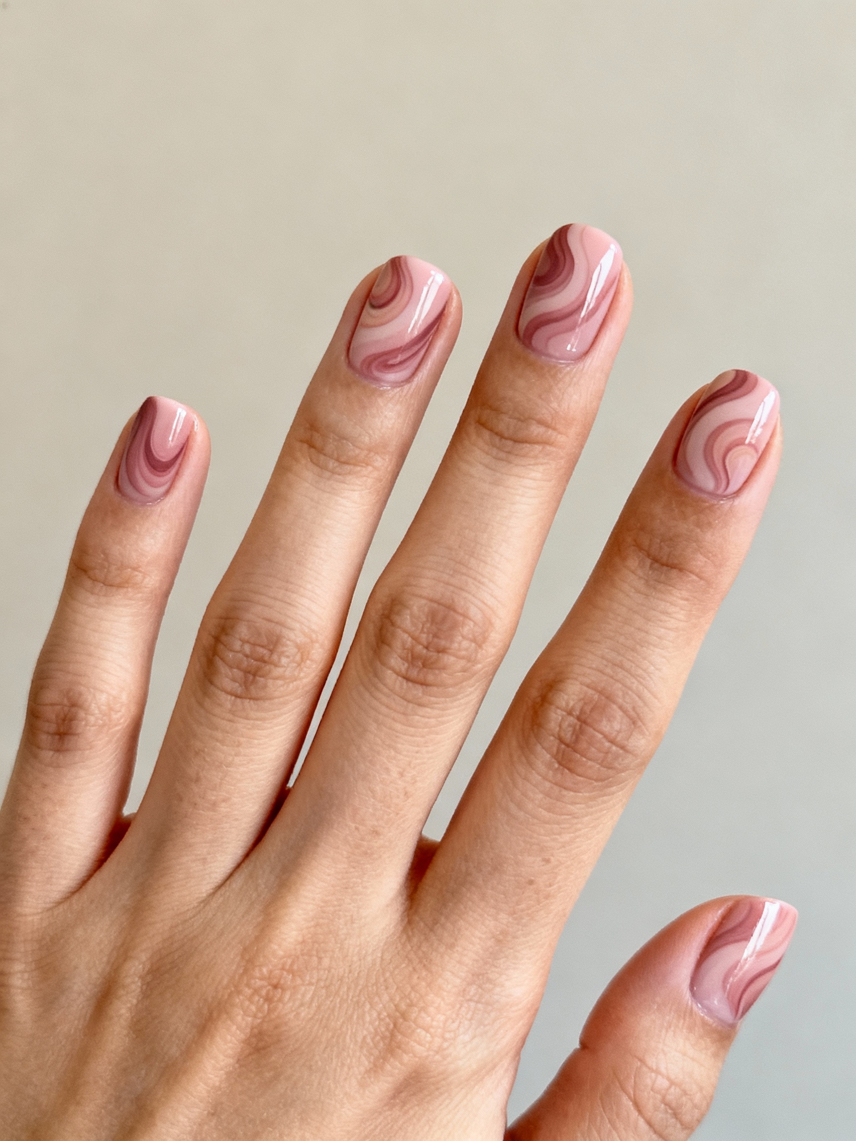 dusty rose swirl nails