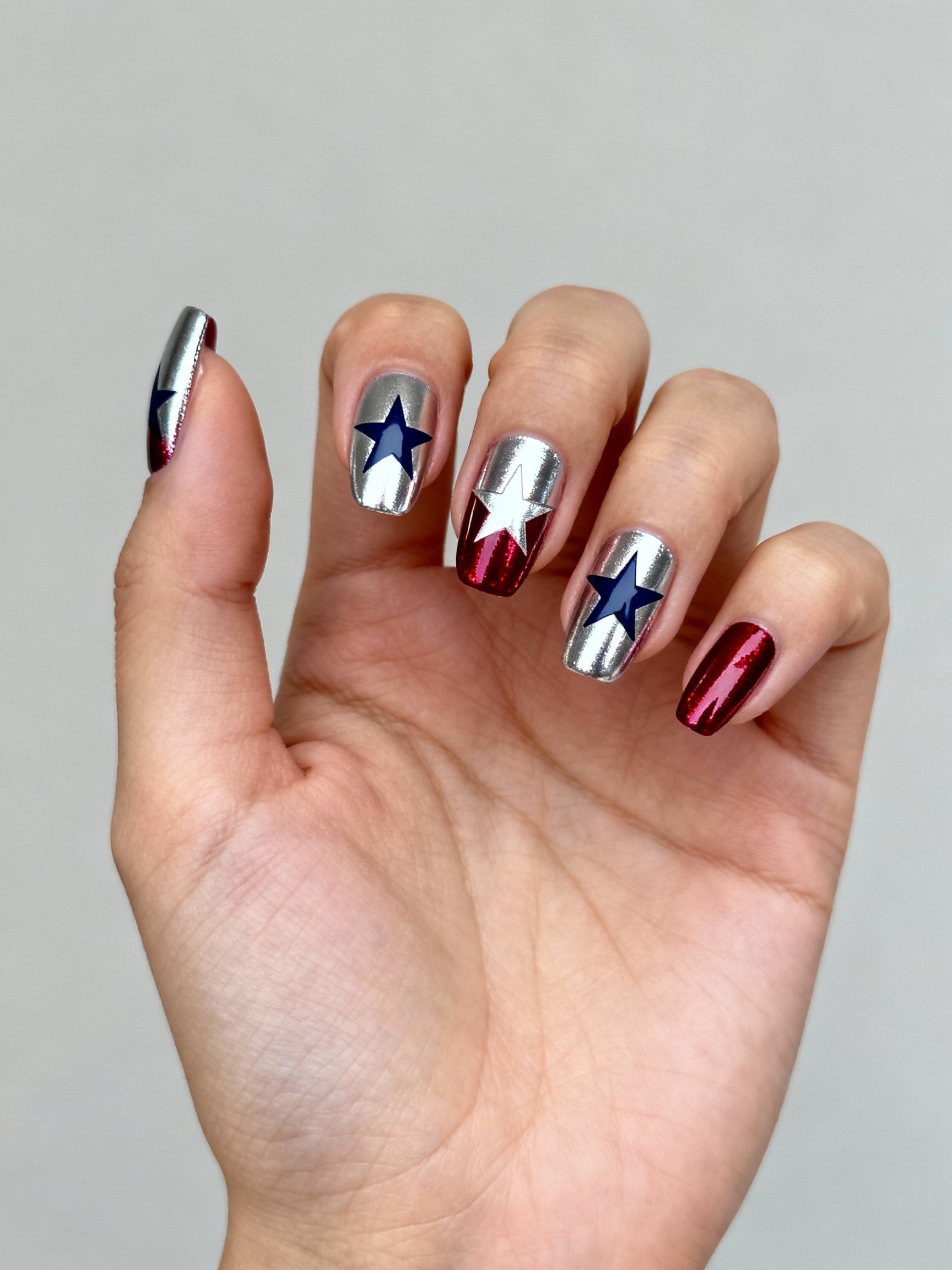 mirrored chrome star blush manicure